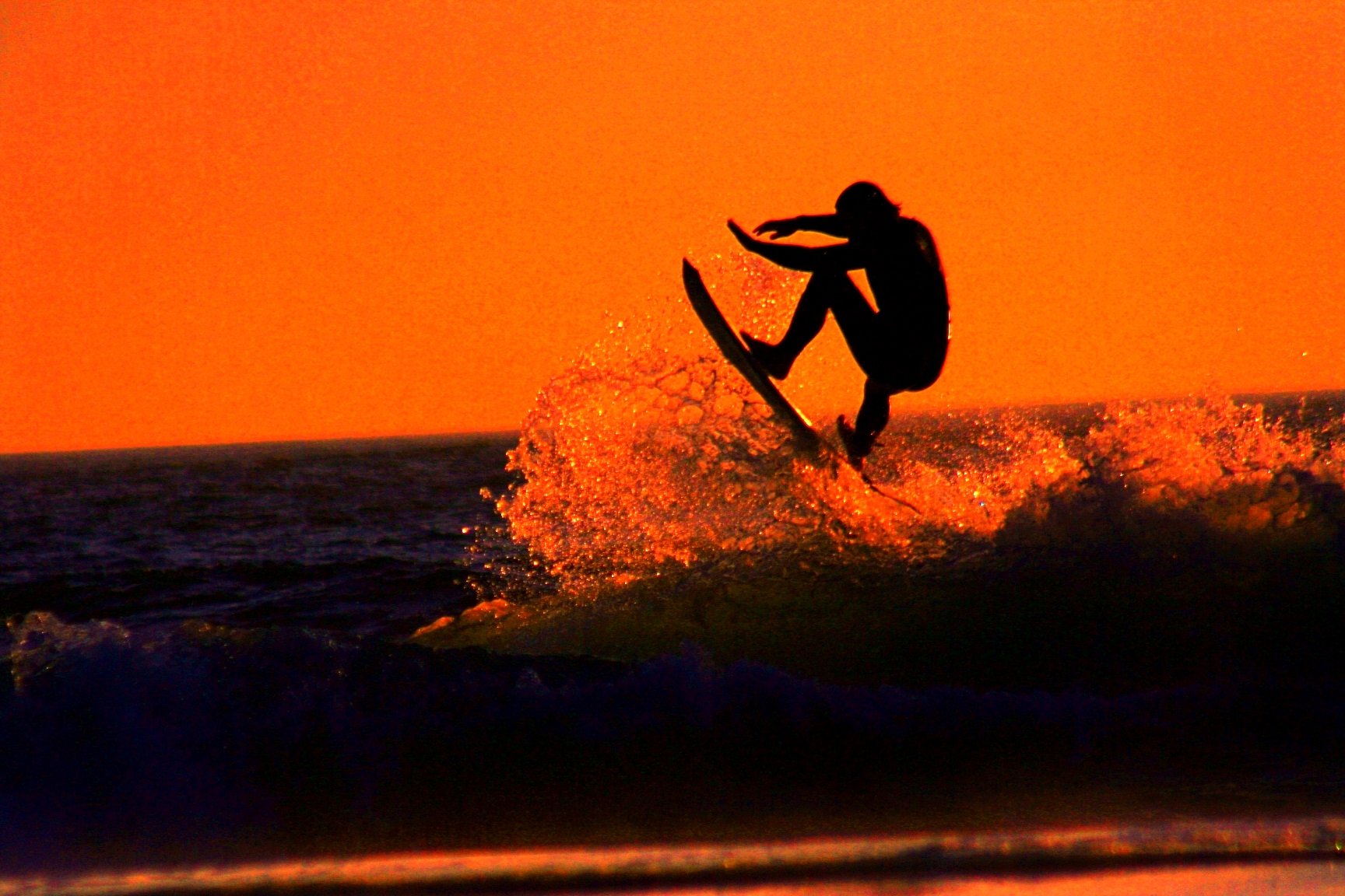 Surfer at sunset